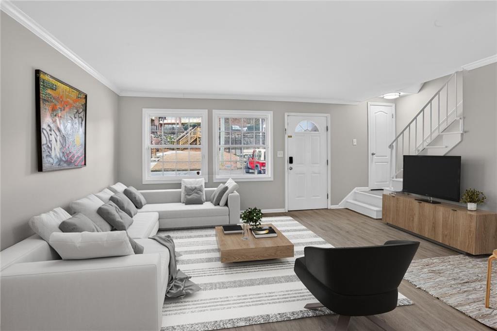 2825 Northeast Expressway, Unit J3 Atlanta, GA 30345 - Photo 2 of 23 a living room with furniture and a flat screen tv