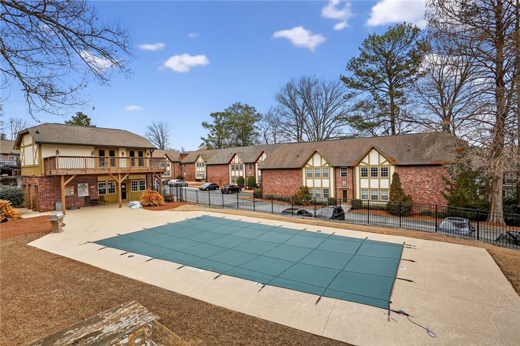 2825 Northeast Expressway, Unit J3 Atlanta, GA 30345 - Photo 22 of 23 a view of a city and patio with a table and chairs under an umbrella