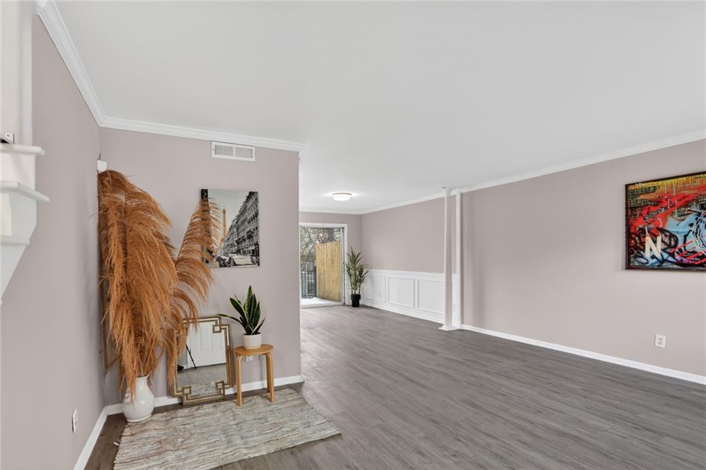 2825 Northeast Expressway, Unit J3 Atlanta, GA 30345 - Photo 3 of 23 a view of a livingroom with wooden floor and a furniture