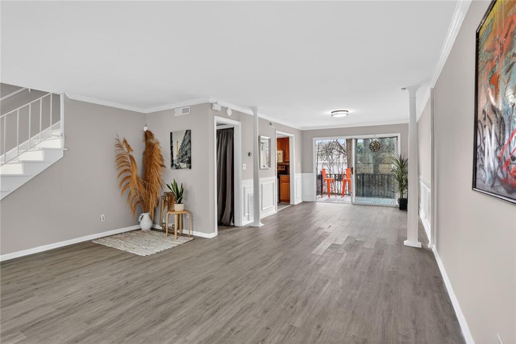 2825 Northeast Expressway, Unit J3 Atlanta, GA 30345 - Photo 4 of 23 a view of an empty room with wooden floor and a window