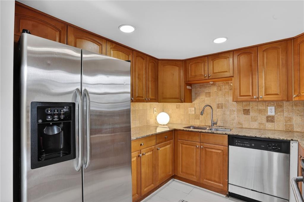 2825 Northeast Expressway, Unit J3 Atlanta, GA 30345 - Photo 10 of 23 a kitchen with a sink and refrigerator