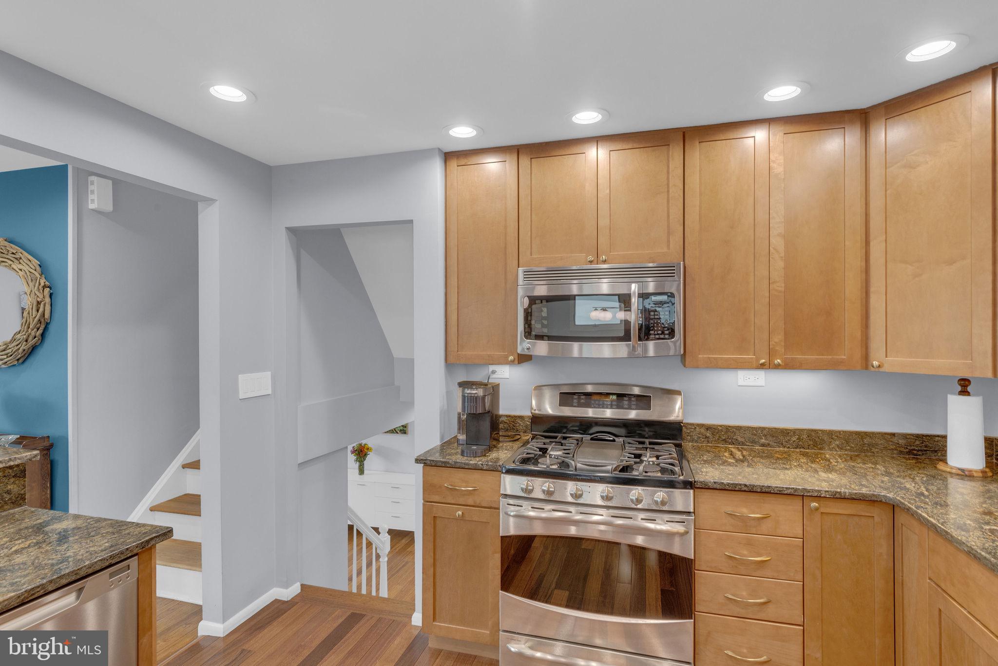 8 Dailey Drive Hamilton, NJ 08620 - Photo 16 of 46 a kitchen with stainless steel appliances granite countertop a stove a sink and a refrigerator
