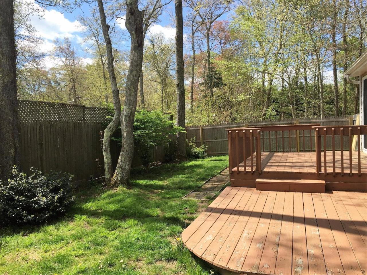 64 Edgewater Road Mashpee, MA 02649 - Photo 17 of 18 a view of a backyard with plants and garden
