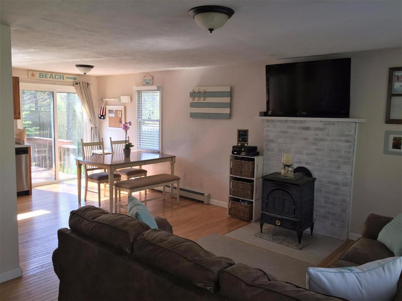 64 Edgewater Road Mashpee, MA 02649 - Photo 8 of 18 a living room with furniture and a flat screen tv
