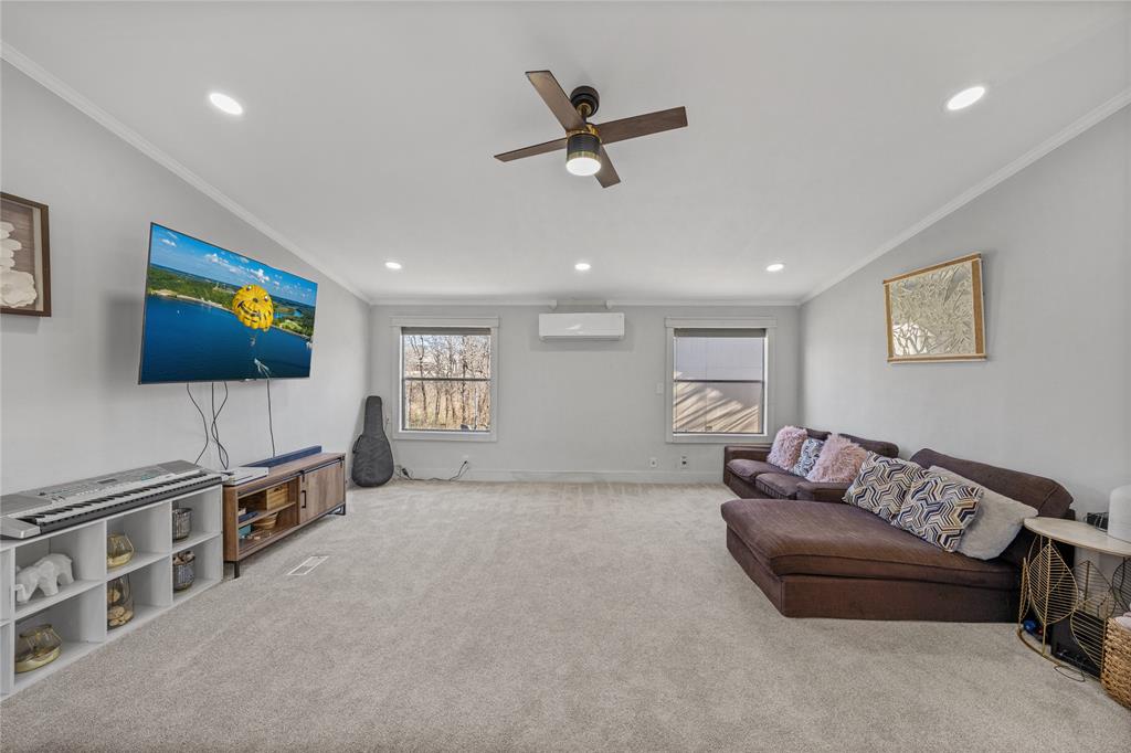169 Cumberland Trail Bridgeport, TX 76426 - Photo 11 of 23 a living room with furniture and a flat screen tv