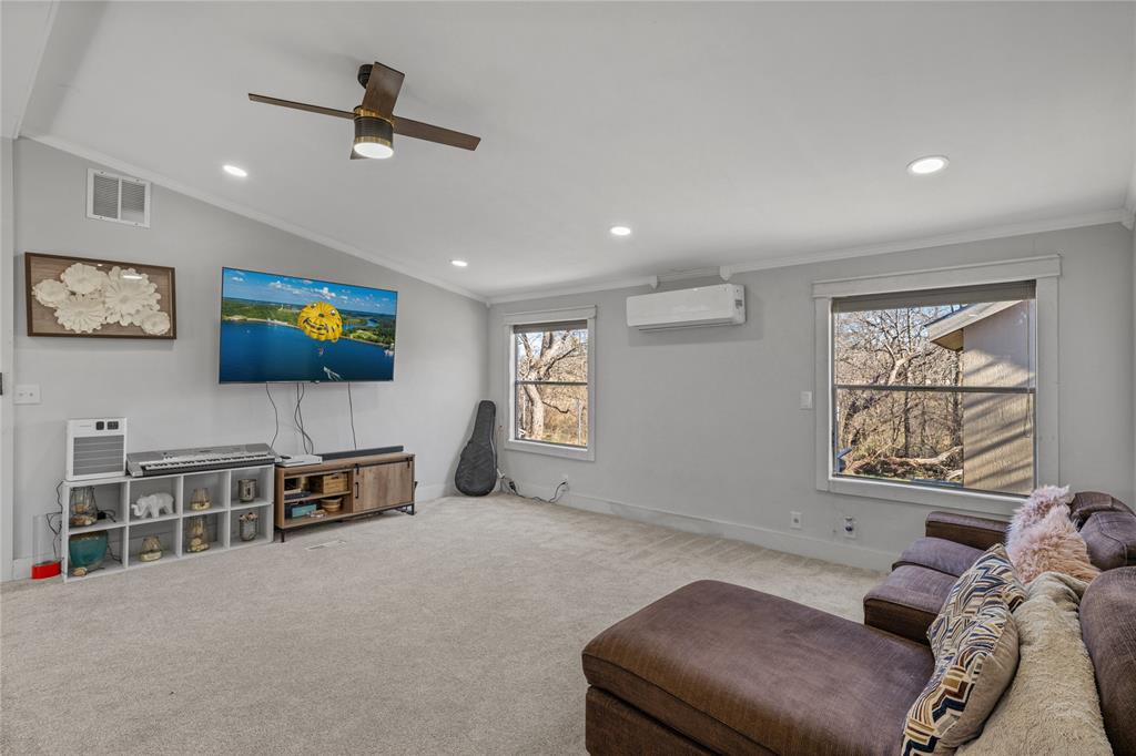 169 Cumberland Trail Bridgeport, TX 76426 - Photo 13 of 23 a living room with furniture and a flat screen tv