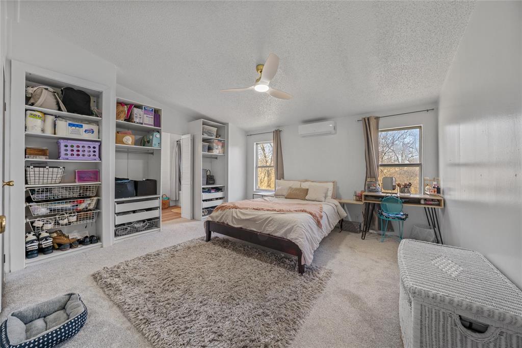 169 Cumberland Trail Bridgeport, TX 76426 - Photo 14 of 23 a bedroom with a bed and furniture