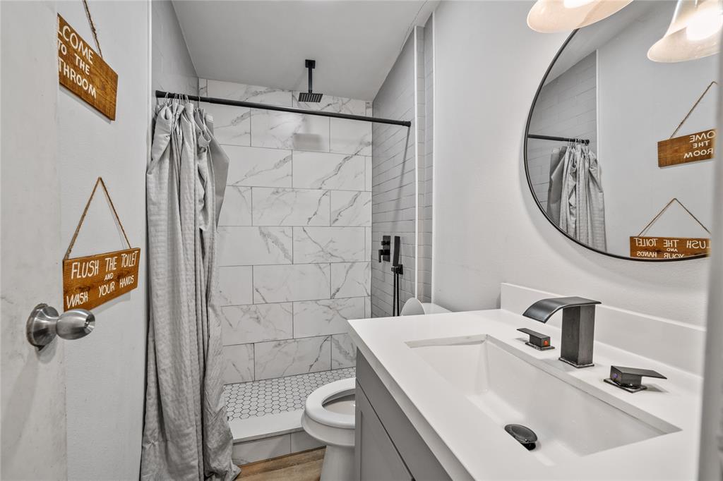 169 Cumberland Trail Bridgeport, TX 76426 - Photo 23 of 23 a bathroom with a sink toilet and shower