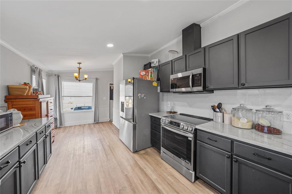 169 Cumberland Trail Bridgeport, TX 76426 - Photo 6 of 23 a kitchen with stainless steel appliances granite countertop a refrigerator stove and sink