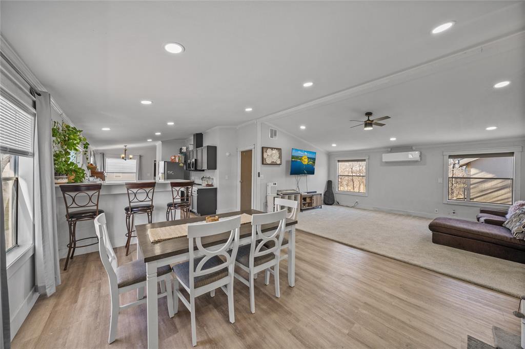 169 Cumberland Trail Bridgeport, TX 76426 - Photo 8 of 23 a view of a dining room with furniture and wooden floor