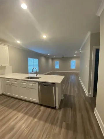 an empty room with closet and a chandelier fan