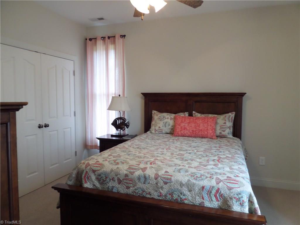 2050 Marina Pointe Road Salisbury, NC 28146 - Photo 12 of 23 2nd Bedroom has a ceiling fan, double closet and a private bath.