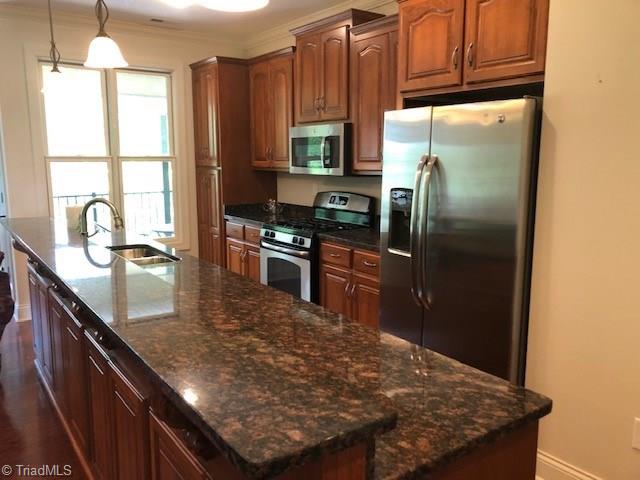2050 Marina Pointe Road Salisbury, NC 28146 - Photo 5 of 23 Kitchen has granite counters and stainless appliances. Refrigerator stays!