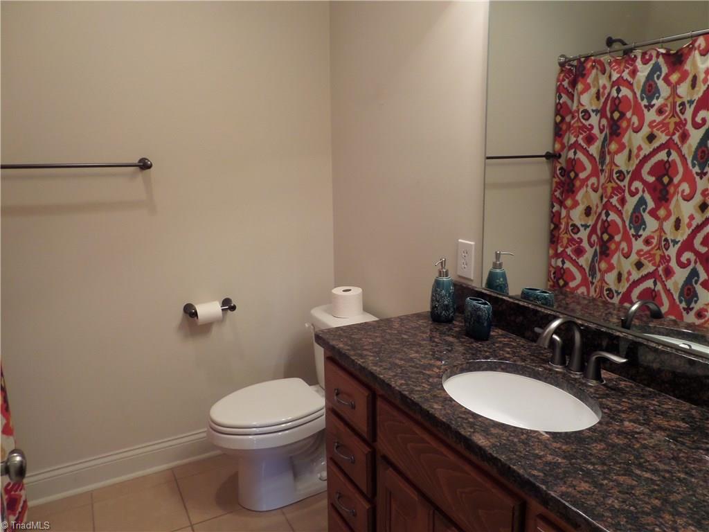 2050 Marina Pointe Road Salisbury, NC 28146 - Photo 9 of 23 Hall full bathroom with tile floor, granite counters and a tub shower combination.