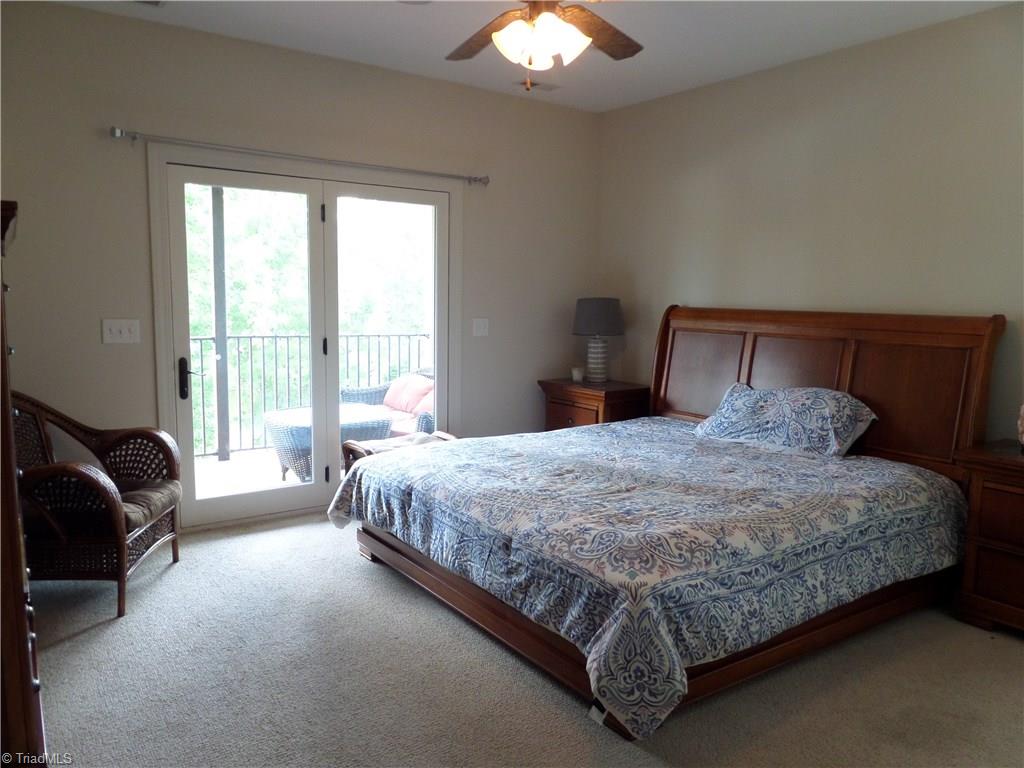 2050 Marina Pointe Road Salisbury, NC 28146 - Photo 10 of 23 Master bedroom has a ceiling fan, walk in closet and a double closet. Also, French doors to the lakeside deck and a private bath.