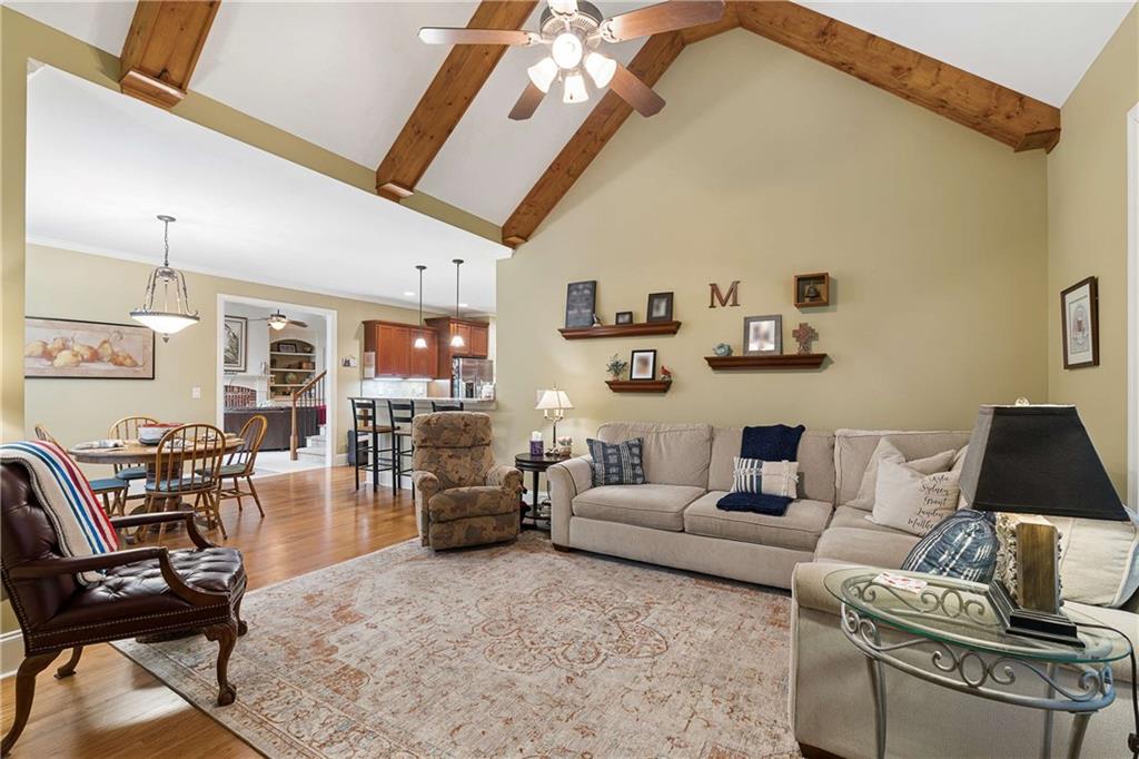 5148 Stefan Ridge Way Buford, GA 30519 - Photo 15 of 39 a living room with furniture and wooden floor