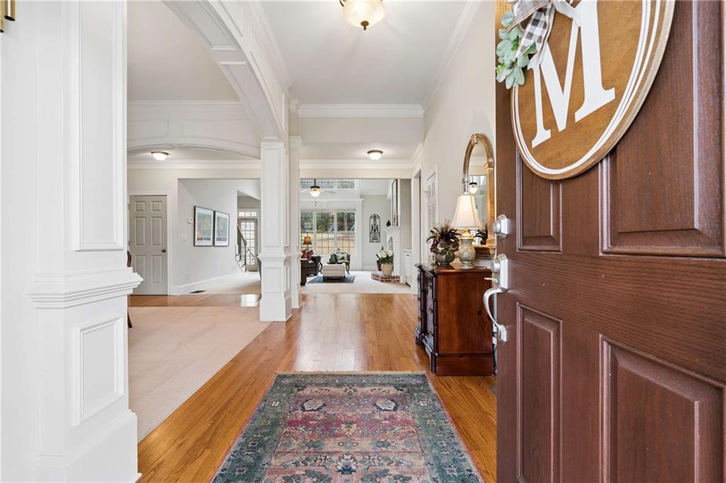 5148 Stefan Ridge Way Buford, GA 30519 - Photo 3 of 39 a bathroom with a tub sink and mirror