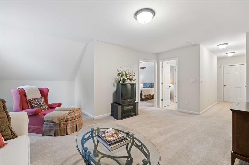 5148 Stefan Ridge Way Buford, GA 30519 - Photo 31 of 39 a bed room with a bed and gym equipment