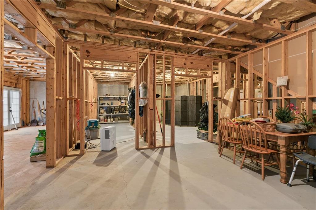 5148 Stefan Ridge Way Buford, GA 30519 - Photo 33 of 39 a view of a chairs with glass door