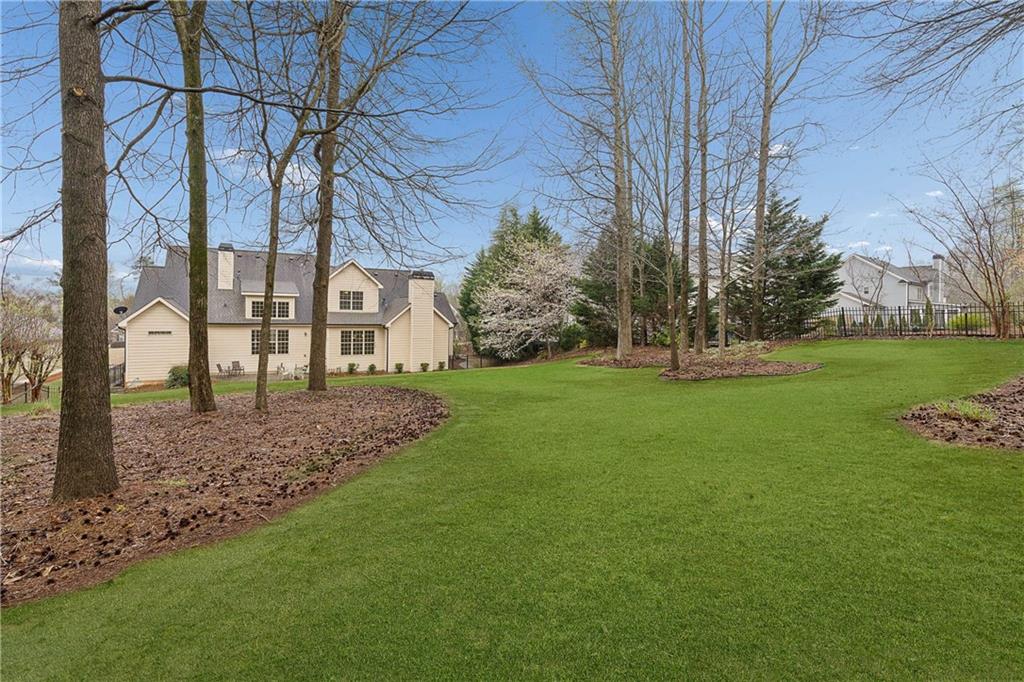5148 Stefan Ridge Way Buford, GA 30519 - Photo 38 of 39 a view of a house with a yard