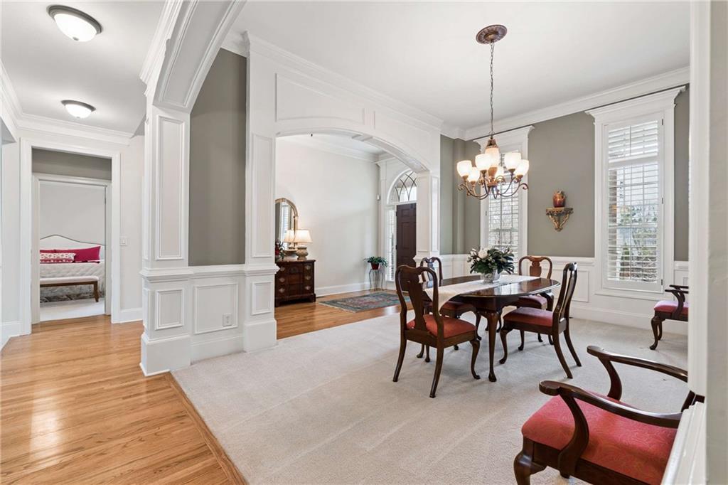 5148 Stefan Ridge Way Buford, GA 30519 - Photo 4 of 39 a view of a dining room with furniture window and wooden floor