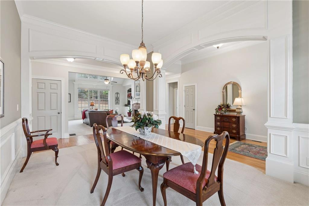 5148 Stefan Ridge Way Buford, GA 30519 - Photo 5 of 39 a view of a dining room with furniture and chandelier