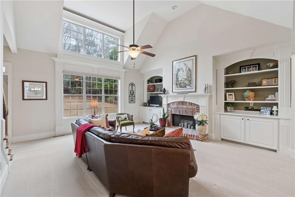 5148 Stefan Ridge Way Buford, GA 30519 - Photo 8 of 39 a living room with furniture and a fireplace