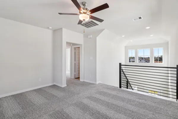 a view of a livingroom with a ceiling fan
