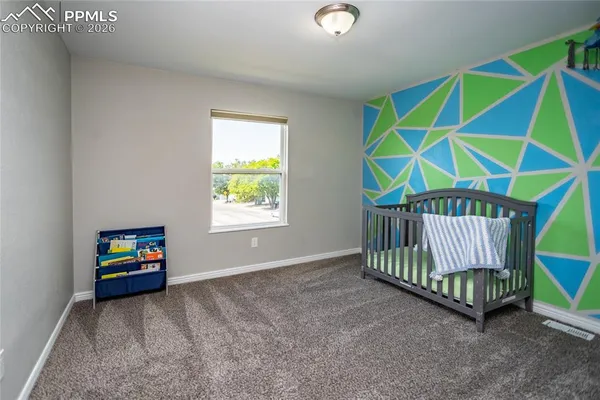 an outdoor living room with furniture and a window