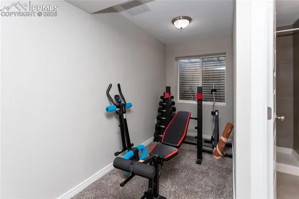 a bathroom with a toilet sink and shower