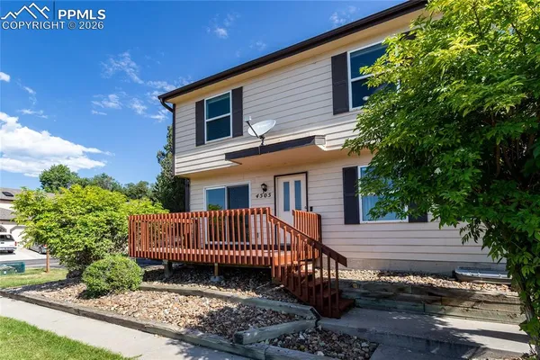 a view of a wooden deck with a bench