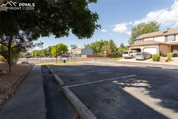 a view of yard with car parked