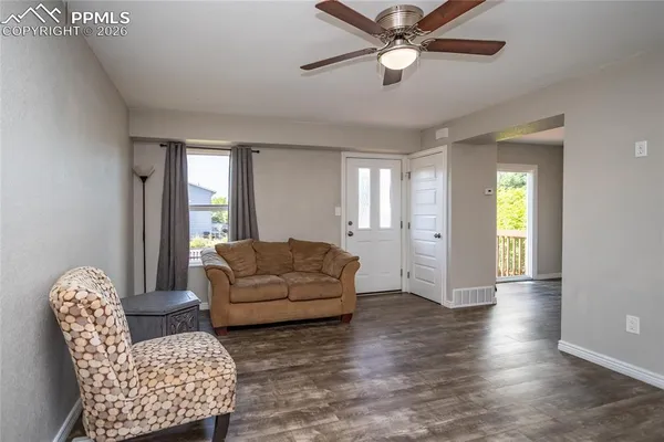 a living room with furniture and a window