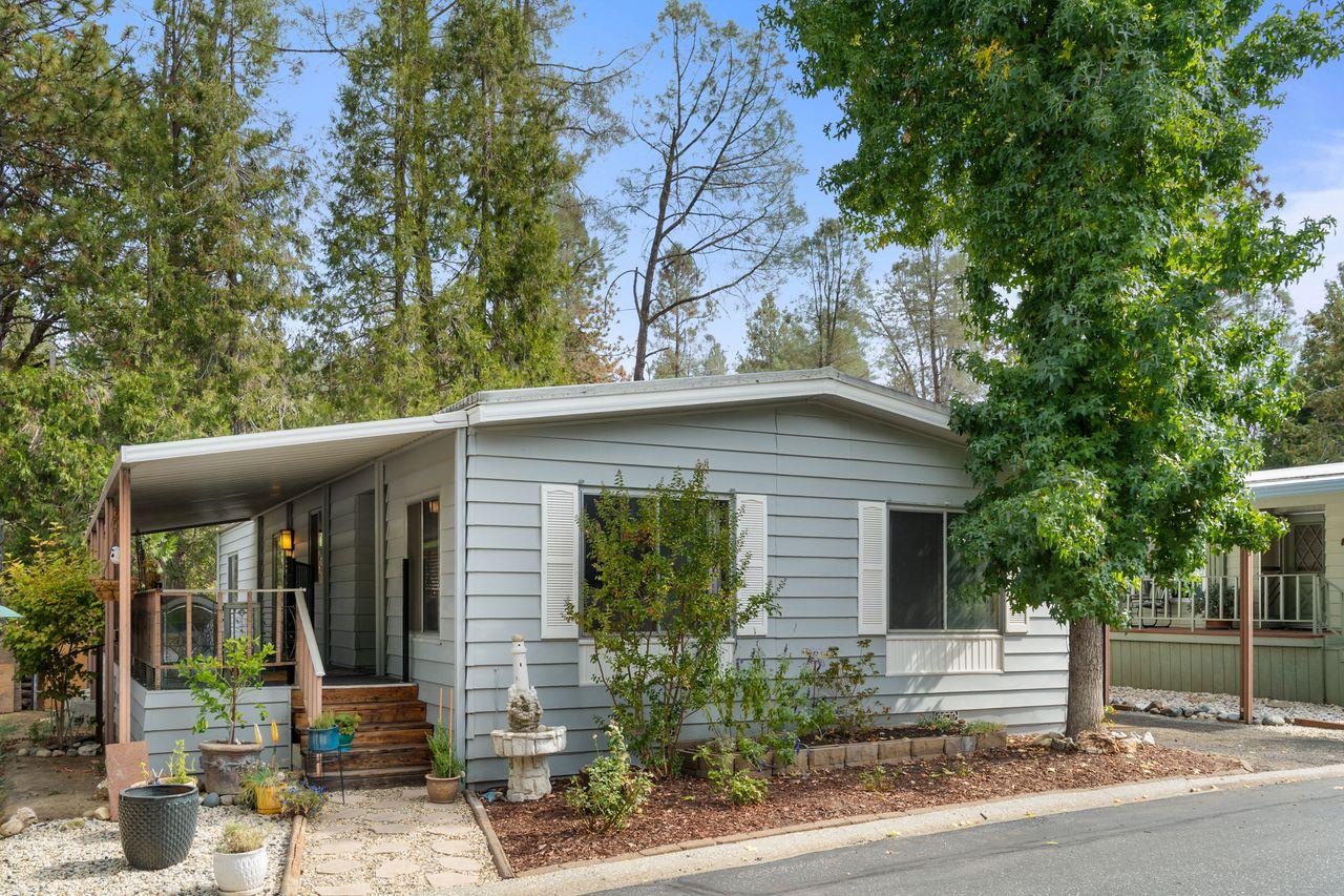 a front view of a house with garden
