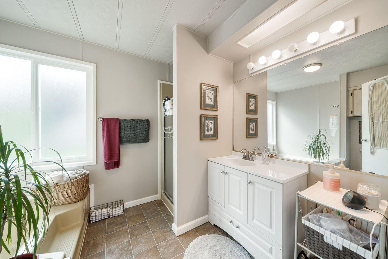 450 Gladycon Road, Unit 52 Colfax, CA 95713 - Photo 15 of 29 a spacious bathroom with a double vanity sink and mirror