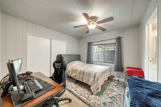 a bedroom with bed and a window