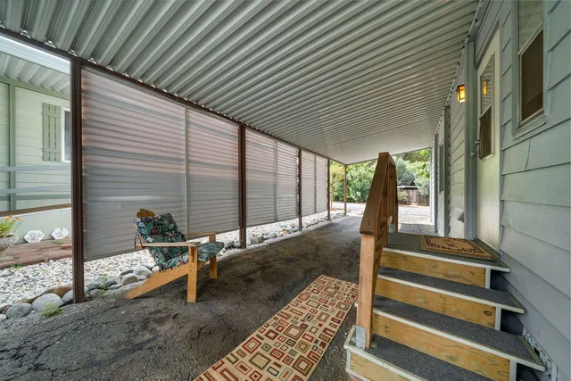 a view of backyard with sitting area