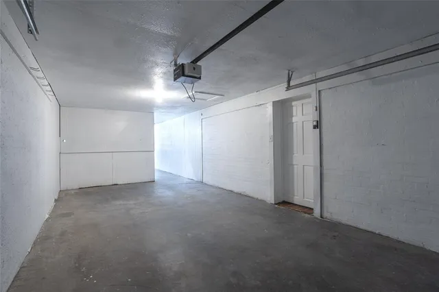 a room with a window and dresser