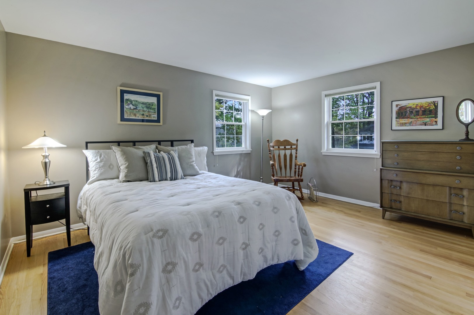 1426 Kenton Road Deerfield, IL 60015 - Photo 11 of 15 a bedroom with a bed and wooden floor