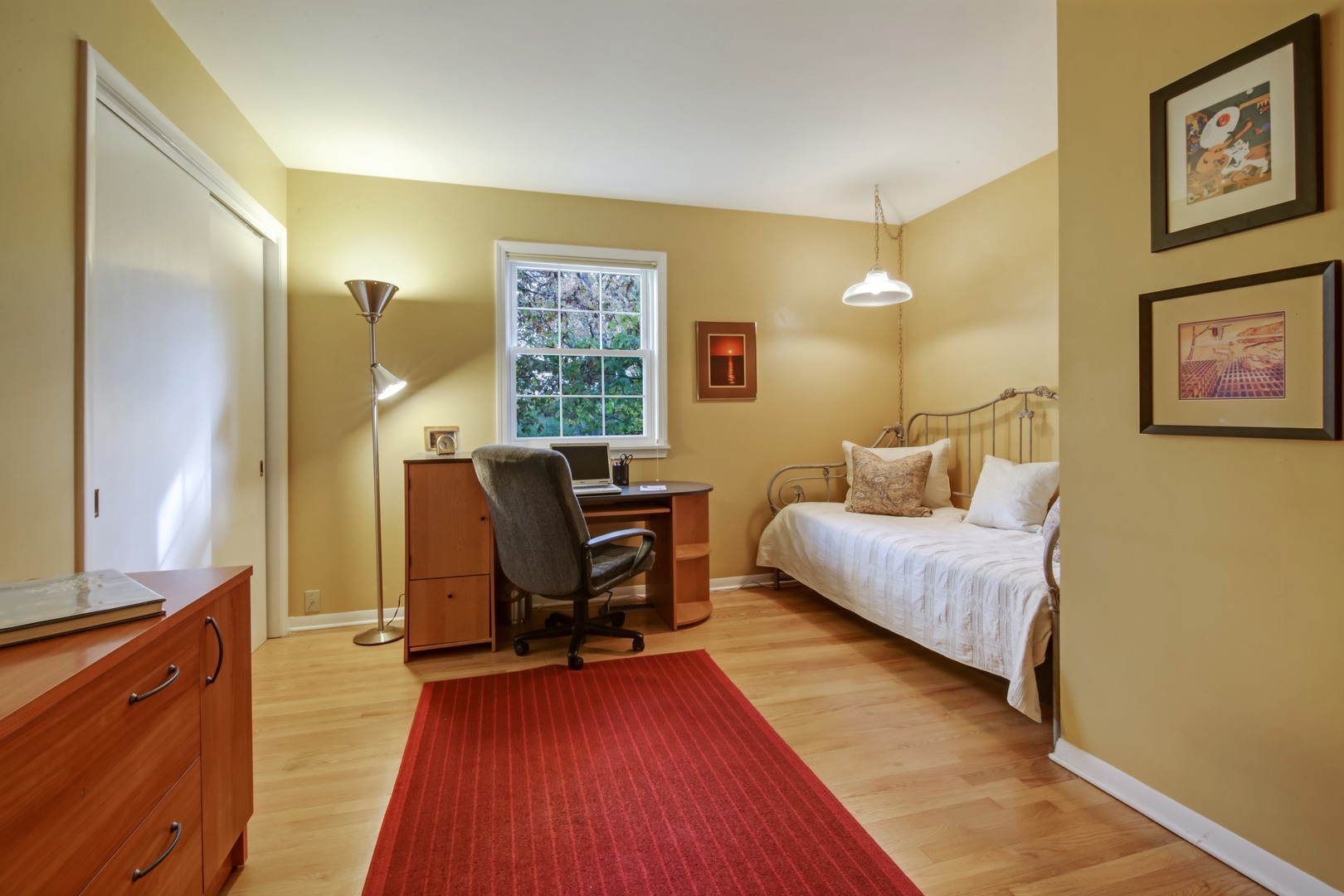 1426 Kenton Road Deerfield, IL 60015 - Photo 12 of 15 a bedroom with a bed and wooden floor