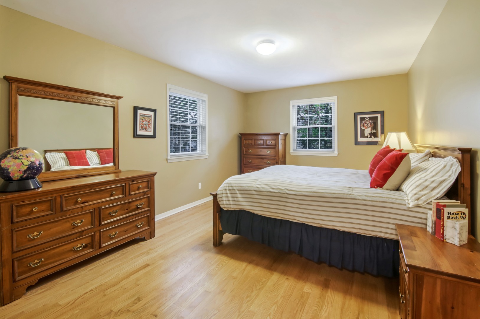 1426 Kenton Road Deerfield, IL 60015 - Photo 10 of 15 a bedroom with a bed and a dresser