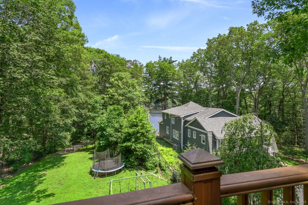 68 Old Dike Road Trumbull, CT 06611 - Photo 12 of 40 a house with green field in front of it