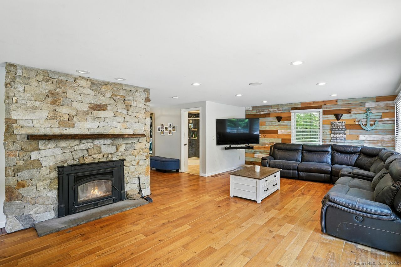 68 Old Dike Road Trumbull, CT 06611 - Photo 17 of 41 a living room with furniture and a fireplace