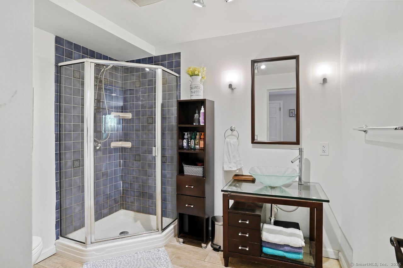 68 Old Dike Road Trumbull, CT 06611 - Photo 18 of 41 a bathroom with a tub shower vanity and sink