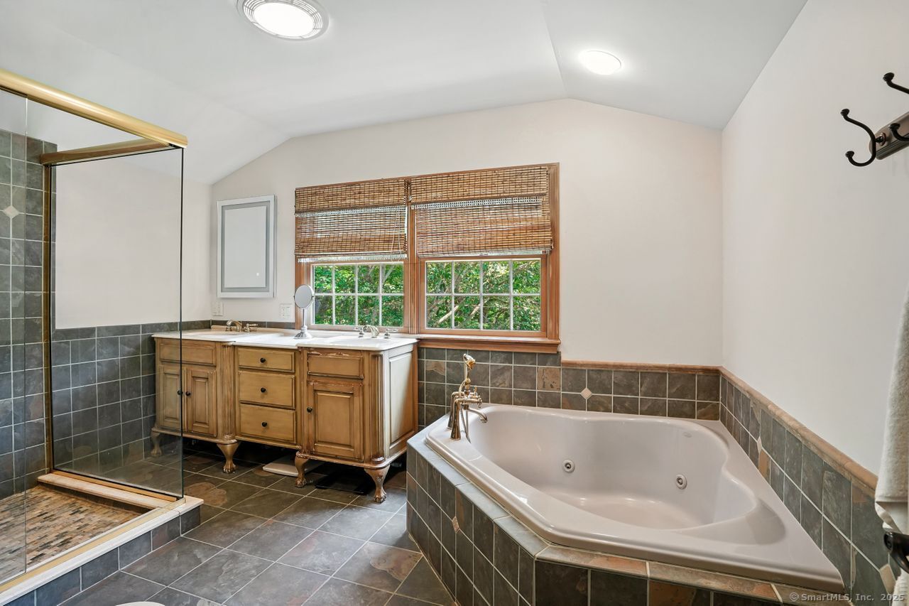 68 Old Dike Road Trumbull, CT 06611 - Photo 21 of 40 a spacious bathroom with a tub sink and window
