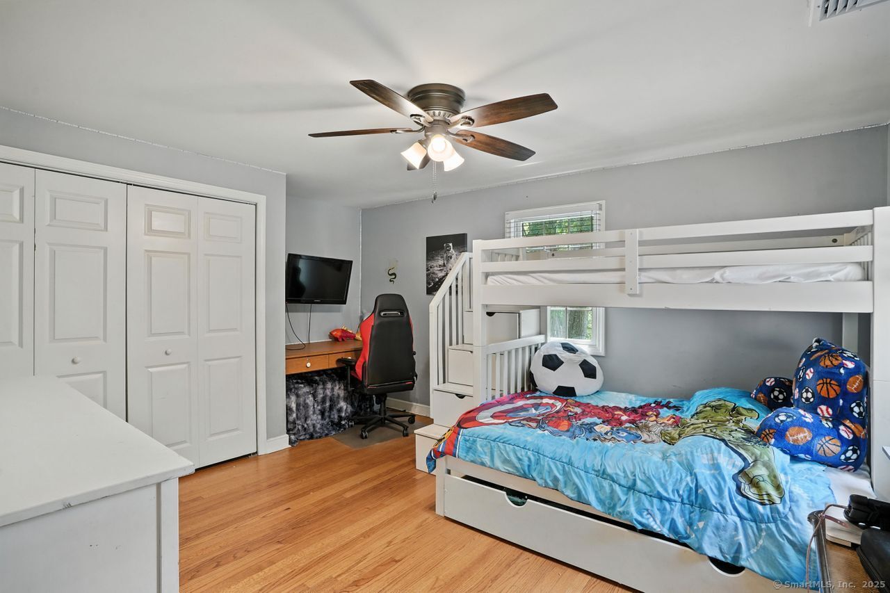 68 Old Dike Road Trumbull, CT 06611 - Photo 28 of 41 a bedroom with a bed and wooden floor