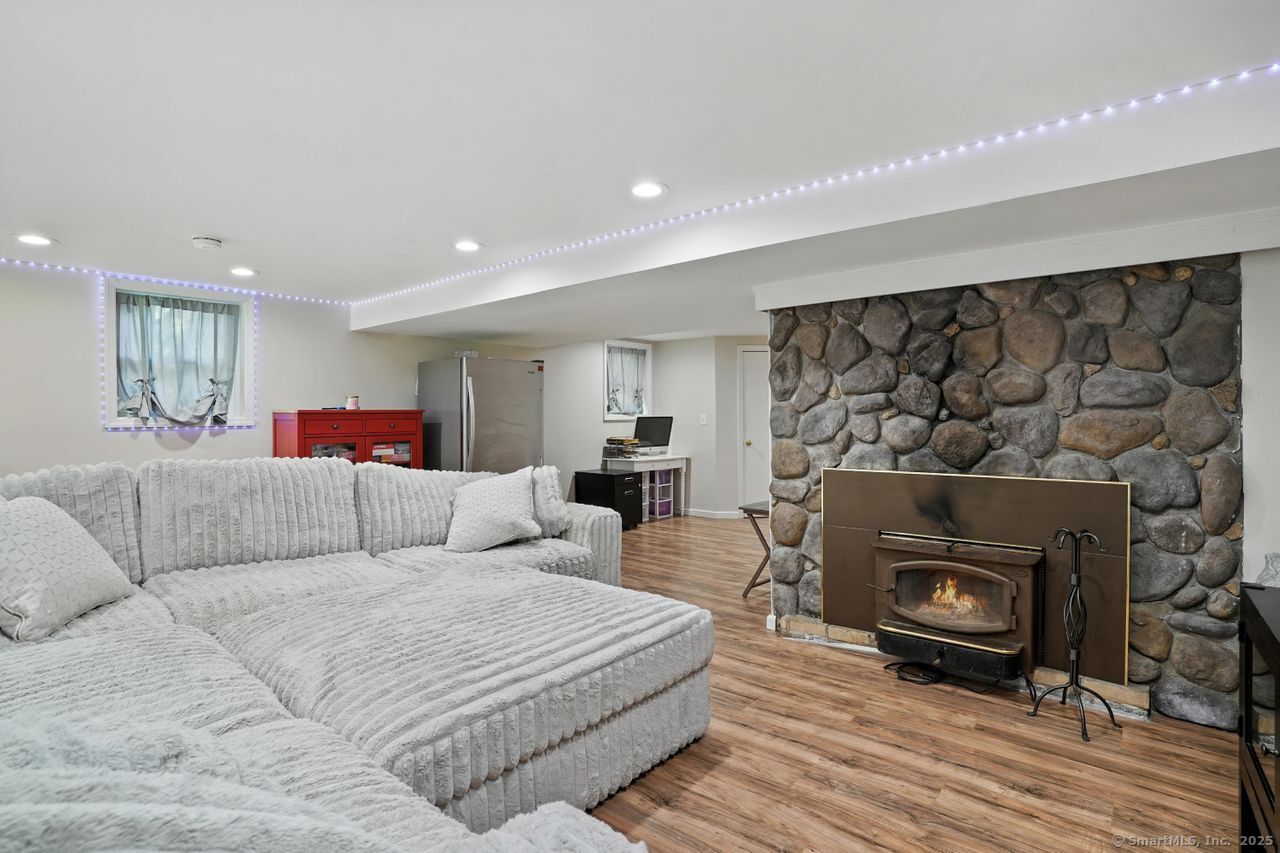 68 Old Dike Road Trumbull, CT 06611 - Photo 28 of 40 a living room with furniture and a fireplace