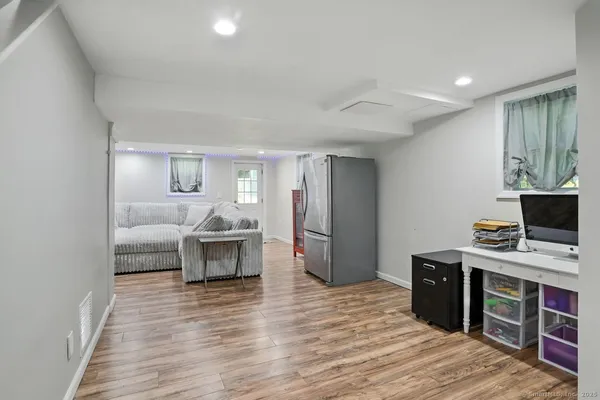 a room with furniture and a wooden floor