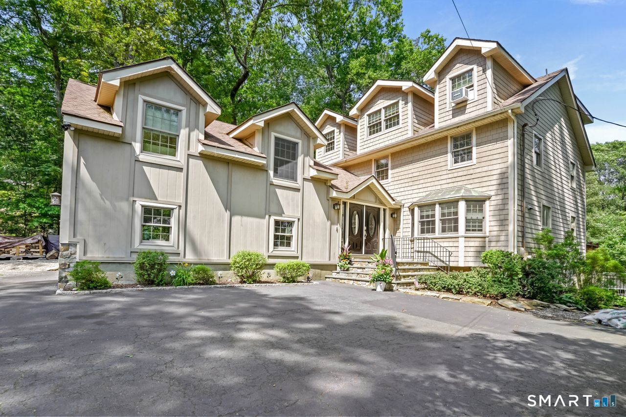 68 Old Dike Road Trumbull, CT 06611 - Photo 3 of 40 a front view of a house with a yard