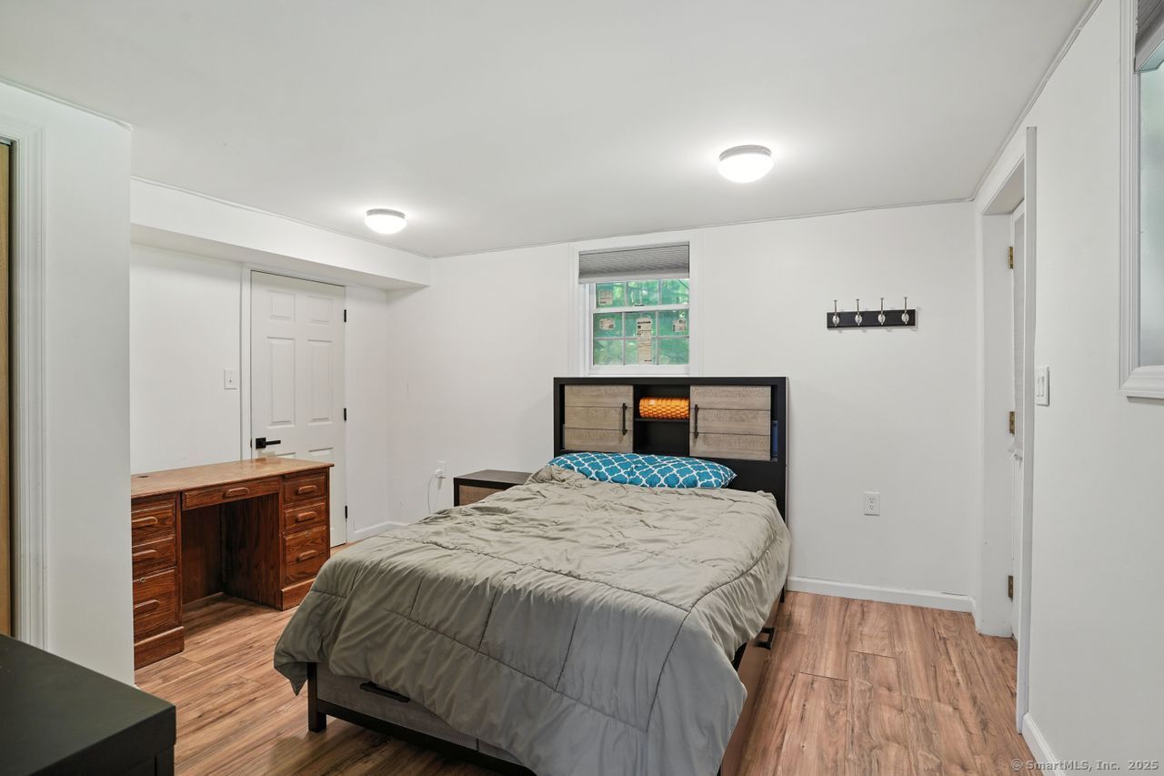 68 Old Dike Road Trumbull, CT 06611 - Photo 32 of 41 a bedroom with a bed and a table